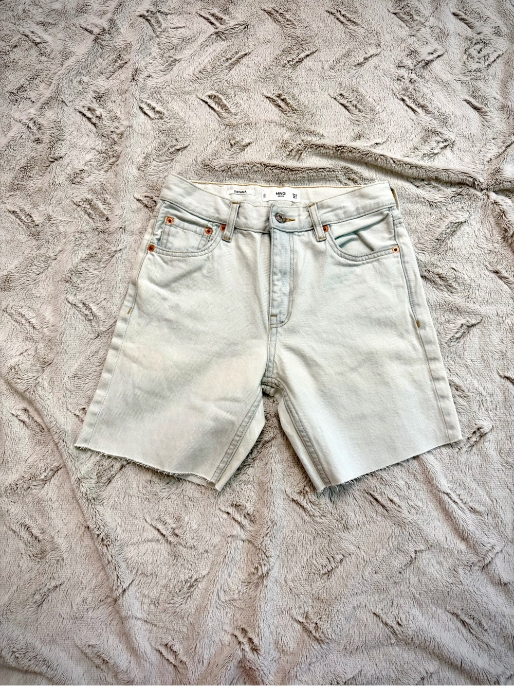 MNG denim shorts feature a light-wash finish and a raw, frayed hem size 2